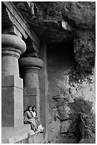 Women sitting at entrance of cave, Elephanta Island. Mumbai, Maharashtra, India ( black and white)
