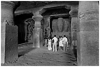 Vistors in main cave, Elephanta Island. Mumbai, Maharashtra, India ( black and white)