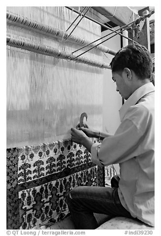 Man making a carpet. Agra, Uttar Pradesh, India (black and white)