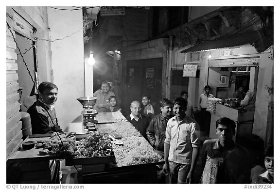 Street with vendor of sweets by night, Taj Ganj. Agra, Uttar Pradesh, India (black and white)