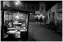 Food vendor and street by night, Taj Ganj. Agra, Uttar Pradesh, India ( black and white)