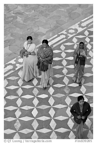Women walking on decorated terrace, Taj Mahal. Agra, Uttar Pradesh, India (black and white)