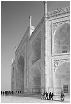 People strolling around main structure, Taj Mahal. Agra, Uttar Pradesh, India (black and white)