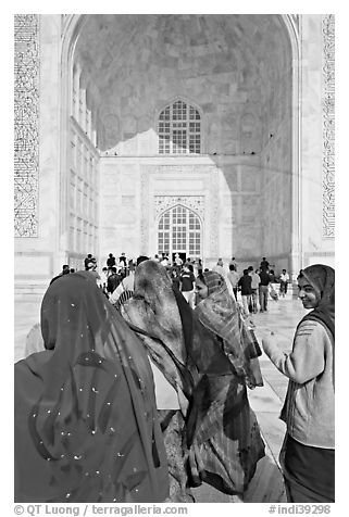 Women in front of main Iwan, Taj Mahal,. Agra, Uttar Pradesh, India (black and white)