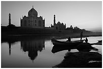 Boat on Yamuna River in front of Taj Mahal, sunset. Agra, Uttar Pradesh, India (black and white)