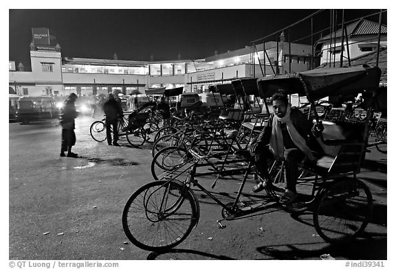 Cycle-rickshaws in front of train station. Agra, Uttar Pradesh, India (black and white)