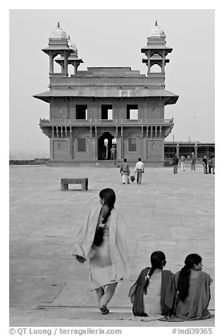 Women, Pachisi courtyard, and Diwan-i-Khas. Fatehpur Sikri, Uttar Pradesh, India (black and white)