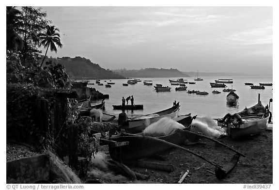 Fishing boats on beach, sunrise. Goa, India (black and white)