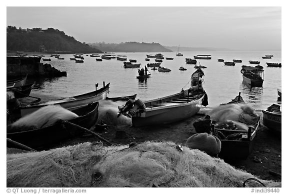 Fishing nets and boats, sunrise. Goa, India (black and white)