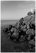 Boulders and christian statues overlooking ocean, Dona Paula. Goa, India (black and white)
