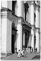 People at the entrance of Se Cathedral, Old Goa. Goa, India ( black and white)
