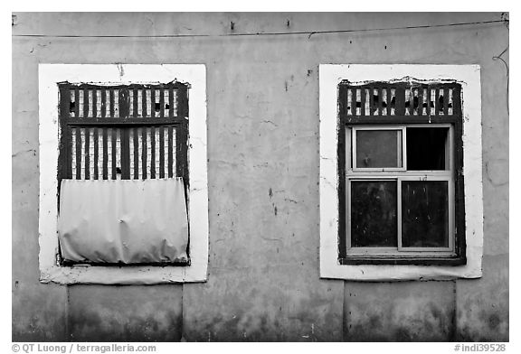 Windows on facade painted blue, Panjim. Goa, India (black and white)