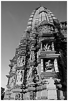 Bands of carved sculptures below spire (sikhara), Javari Temple, Eastern Group. Khajuraho, Madhya Pradesh, India ( black and white)
