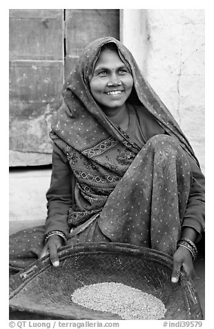 Woman sorting grains. Khajuraho, Madhya Pradesh, India (black and white)