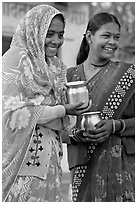 Women with pots used for religious offerings. Khajuraho, Madhya Pradesh, India ( black and white)