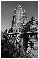 Women going down stairs in front of Lakshmana temple. Khajuraho, Madhya Pradesh, India ( black and white)