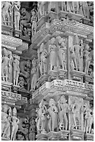 Sculptural details with apsaras, Kadariya-Mahadev temple. Khajuraho, Madhya Pradesh, India ( black and white)