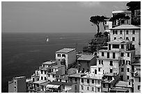 Houses built on the sides of steep hills overlook the Mediterranean, Riomaggiore. Cinque Terre, Liguria, Italy (black and white)