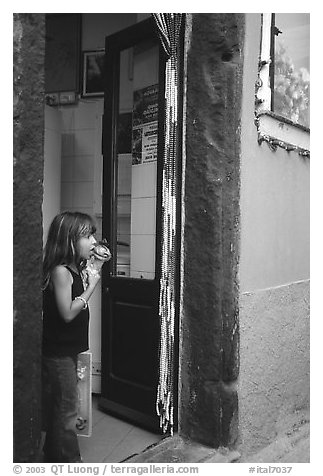 Girl enjoying gelato (ice-cream), Vernazza. Cinque Terre, Liguria, Italy