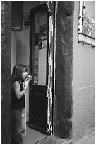 Girl enjoying gelato (ice-cream), Vernazza. Cinque Terre, Liguria, Italy (black and white)