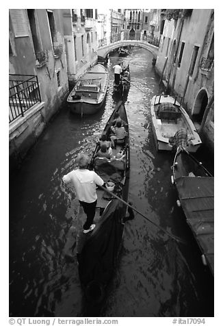 Gondolas lined up in narrow canal. Venice, Veneto, Italy