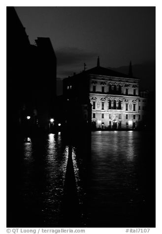 Rezzonico palace illuminated at night, along the Grand Canal. Venice, Veneto, Italy (black and white)