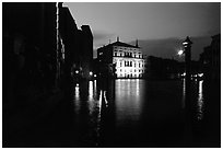 Grand Canal at night with lighted palace. Venice, Veneto, Italy (black and white)