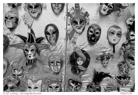 Carnival masks over golden background, Burano. Venice, Veneto, Italy