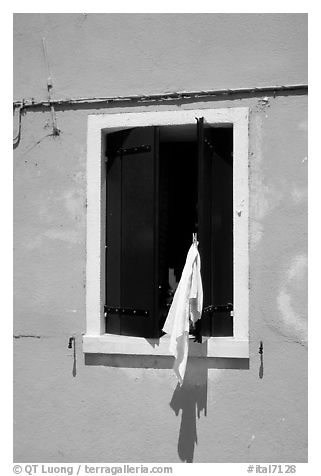 Laundry hanging from a window, Burano. Venice, Veneto, Italy (black and white)