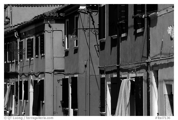 Facades of brightly painted houses, Burano. Venice, Veneto, Italy (black and white)