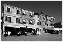 Street with brightly painted houses, Burano. Venice, Veneto, Italy ( black and white)