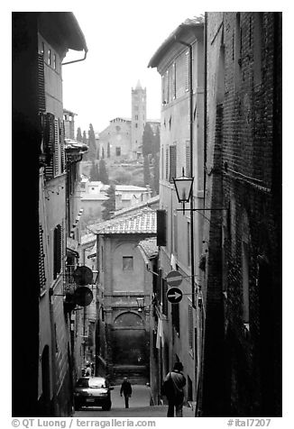 Narrow street with church in background. Siena, Tuscany, Italy (black and white)