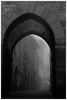 Arch at dawn in the fog. San Gimignano, Tuscany, Italy ( black and white)