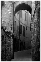 Arch and narrow street. San Gimignano, Tuscany, Italy ( black and white)