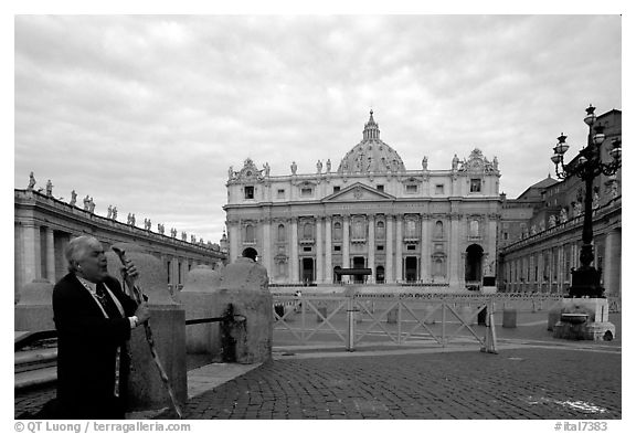 Pilgrim prays in front of the Basilic Saint Peter. Vatican City (black and white)