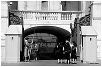 Nuns move past checkpoint manned by Swiss guards. Vatican City ( black and white)