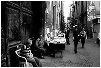 Via San Giogio dei Librai, one of the liveliest roads in Spaccanapoli. Naples, Campania, Italy ( black and white)