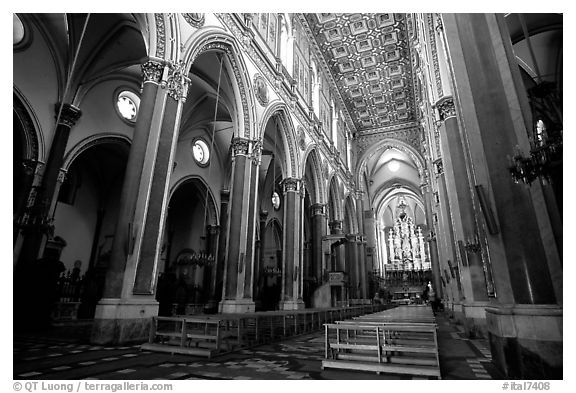 Church interior looking down the nave to the apse. Naples, Campania, Italy (black and white)