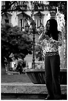 Young woman talking on a cell phone. Naples, Campania, Italy (black and white)