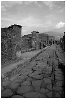 Paved street and ruins. Pompeii, Campania, Italy ( black and white)