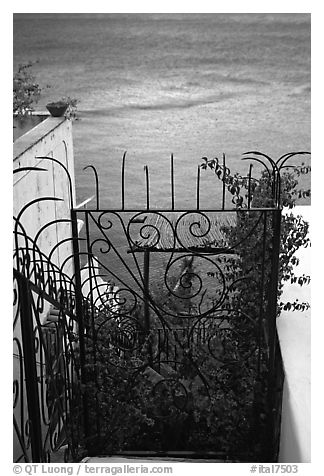 Forged metal entrance to a garden overlooking the sea, Positano. Amalfi Coast, Campania, Italy