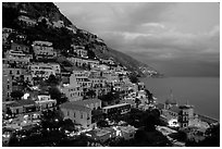 Positano lights coming up at dusk. Amalfi Coast, Campania, Italy ( black and white)