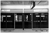Platform screen doors in subway. Daegu, South Korea ( black and white)