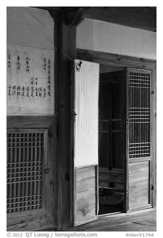 Wooden interior doors in residence. Hahoe Folk Village, South Korea (black and white)