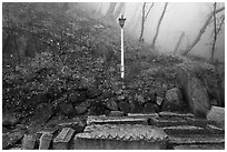 Stones and lantern in fog, Seokguram. Gyeongju, South Korea (black and white)