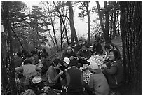 Large group of hikers eating on Geumobong Peak, Namsan Mountain. Gyeongju, South Korea ( black and white)