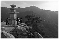 Women circling stone pagoda, Mt Namsan. Gyeongju, South Korea (black and white)