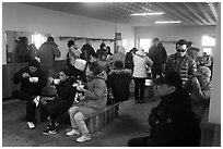 Hikers eating noodles inside Witseoreum shelter, Hallasan. Jeju Island, South Korea (black and white)