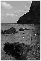 Cove with Haeneyo woman diving. Jeju Island, South Korea (black and white)