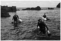 Women divers emerging from water. Jeju Island, South Korea ( black and white)